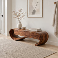 Looping wooden bench with a ribbon shaped frame and two drawers in a Scandinavian entryway with white walls