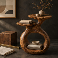 Corner detail of side table with a looped ring base and two scalloped dish tops beside wood, brass and linen samples