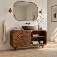 Bathroom vanity with ripple carved doors, open shelves and short tapered feet in a Scandinavian bathroom with white walls