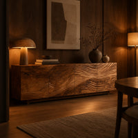 Low sideboard with four carved wave panels on a recessed plinth base in an evening dining room with walnut wall paneling