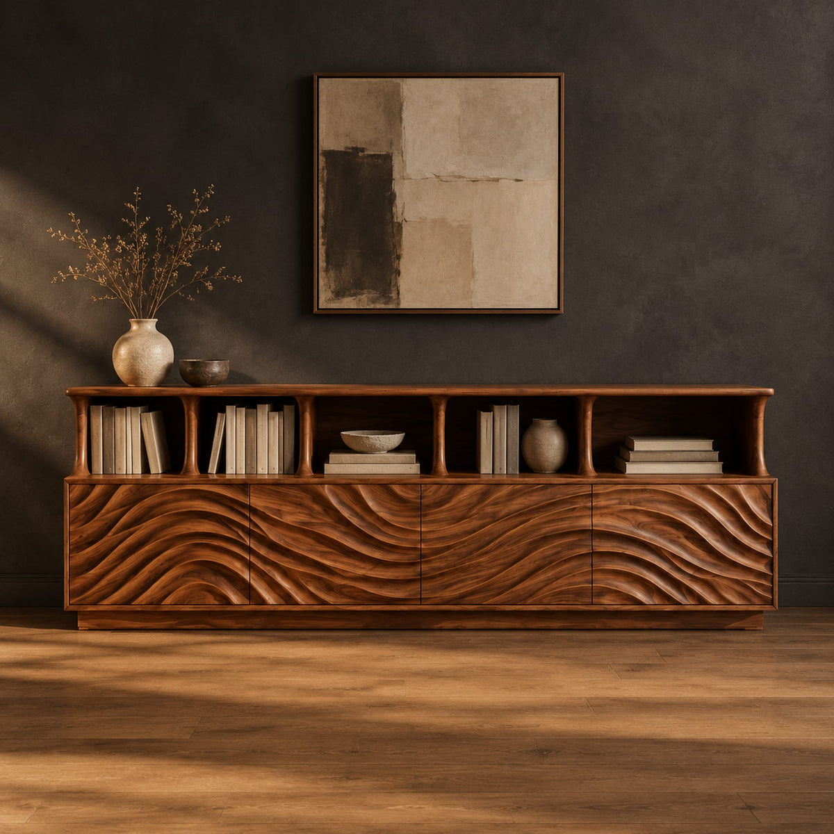 Tv stand with ripple carved front panels and four open display shelves in a dark studio against a charcoal plaster wall