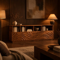 Tv stand with ripple carved front panels and four open display shelves in an evening living room with walnut wall paneling