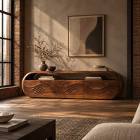 Capsule shaped tv stand with three wave carved front panels in an industrial loft living room with exposed brick