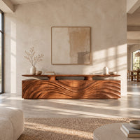 Low wooden tv stand with wave carved doors and a raised top shelf in a bright open plan living room