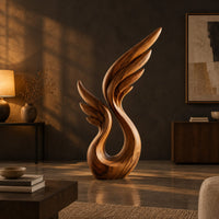 Wing sculpture with layered feathers rising from an open loop in a dark living room at golden hour