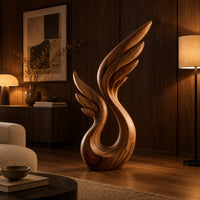 Wing sculpture with layered feathers rising from an open loop in an evening living room with walnut wall paneling
