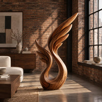Wing sculpture with layered feathers rising from an open loop in an industrial loft living room with exposed brick