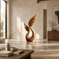 Wing sculpture with layered feathers rising from an open loop in a bright open plan living room