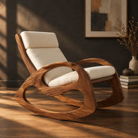 Rocking chair with looped side frames, curved runners and long cushions, three-quarter view showing the grain