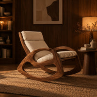Rocking chair with looped side frames, curved runners and long cushions in an evening living room with walnut wall paneling