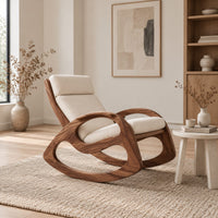 Rocking chair with looped side frames, curved runners and long cushions in a Scandinavian living room with white walls