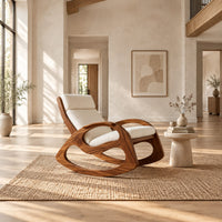 Rocking chair with looped side frames, curved runners and long cushions in a bright open plan living room