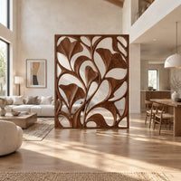 Openwork room divider with carved fan shaped leaves in a slim frame in a bright open plan open-plan living room