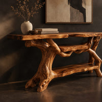 Corner detail of console table with a branch root base, two slab tops and two shelves beside wood, brass and linen samples