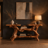 Console table with a branch root base, two slab tops and two shelves in a dark entryway at golden hour