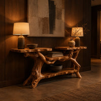 Console table with a branch root base, two slab tops and two shelves in an evening entryway with walnut wall paneling