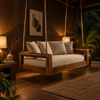 Rope hung swing with open frame arms and a deep seat cushion in an evening porch with walnut wall paneling