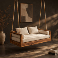 Wooden swing hung from four thick ropes with a low solid wood frame, three-quarter view showing the grain