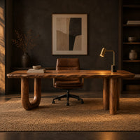 Plank top desk with a u shaped leg and two column legs in a dark home office at golden hour