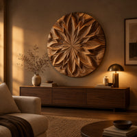 Round carved wood wall art with a radiating petal mandala pattern above a low console in an evening living room