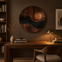 Round carved wall art with a sun disc over layered waves above a desk in a dark study corner