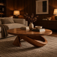 Round coffee table with a cone foot and a tilted open loop base in an evening living room with walnut wall paneling