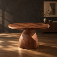 Circular dining table with a faceted bell shaped pedestal base, three-quarter view showing the grain