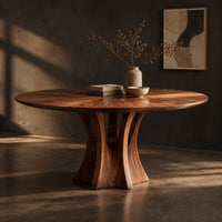 Round dining table with a flared pedestal base and a radiating grain top, three-quarter view showing the grain