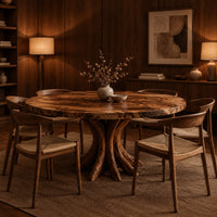 Circular dining table with a swirl grain top and flared trunk shaped legs in an evening dining room with walnut wall paneling