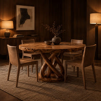 Round dining table with an interwoven wood loop base in an evening dining room with walnut wall paneling