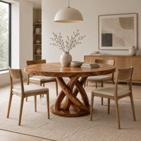Round dining table with an interwoven wood loop base in a Scandinavian dining room with white walls