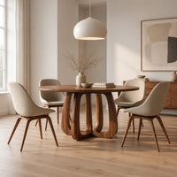 Round dining table with a thick pedestal base of arched wooden loops in a Scandinavian dining room with white walls