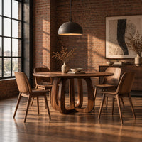 Round dining table with a thick pedestal base of arched wooden loops in an industrial loft dining room with exposed brick