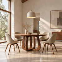 Round dining table with a thick pedestal base of arched wooden loops in a bright open plan dining room
