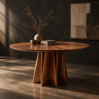 Round dining table with a sunburst grain top and a faceted star pedestal, three-quarter view showing the grain