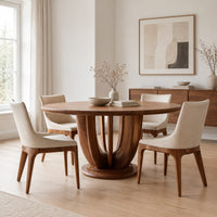 Round dining table on a pedestal of tall arched wooden slats in a Scandinavian dining room with white walls