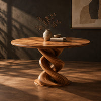 Round dining table with a twisted spiral pedestal and a flat disc foot, three-quarter view showing the grain