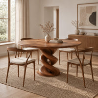 Round dining table with a twisted spiral pedestal and a flat disc foot in a Scandinavian dining room with white walls