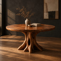 Circular dining table on a hollow tree trunk pedestal with spreading roots, three-quarter view showing the grain
