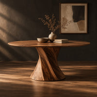 Round dining table with a twisted hourglass pedestal, three-quarter view showing the grain