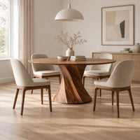 Round dining table with a twisted hourglass pedestal in a Scandinavian dining room with white walls