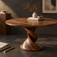 Corner detail of round dining table with a twisted pedestal and disc base beside wood, brass and linen samples
