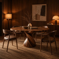 Circular dining table with twisted pedestal base and rippled edge in an evening dining room with walnut wall paneling