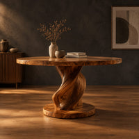 Round dining table with a spiral twisted pedestal on a thick disc base in a dark studio against a charcoal plaster wall