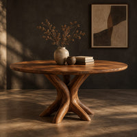 Circular dining table with a pedestal of twisting branch shaped limbs, three-quarter view showing the grain
