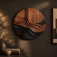 Round wall art with stepped wave ridges in two tones on a dark charcoal plaster wall