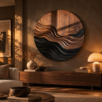 Round wall art with stepped wave ridges in two tones above a low console in an evening living room
