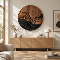 Round wall art with stepped wave ridges in two tones above a light oak sideboard in daylight