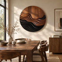 Round wall art with stepped wave ridges in two tones beside a dining table in natural light