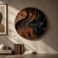 Detail of round wall art with layered wave ridges and a dark hollow beside wood, brass and linen samples